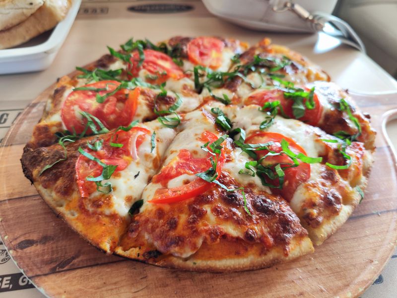 Classic Margherita marco's pizza with fresh basil and mozzarella