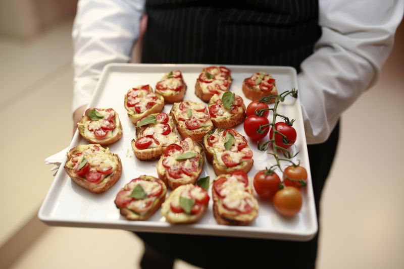 Garlic bread bruschetta topped with fresh tomatoes