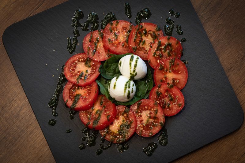 Caprese salad with tomatoes, mozzarella and basil