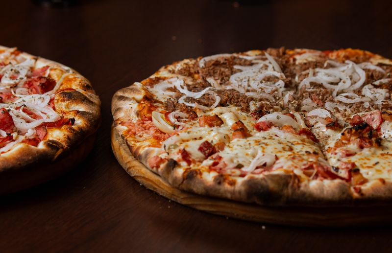 BBQ Chicken marco pizza with caramelized onions and smoky sauce